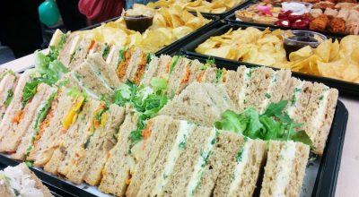 A selection of sandwiches, crisps, savoury snacks and dips. Corporate catering for meetings, lunches and parties.  Close up image of food.